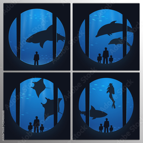 Big Aquarium, Oceanarium or Dolphinarium With dolphin, shark and crampfish. People with children watching the underwater world.