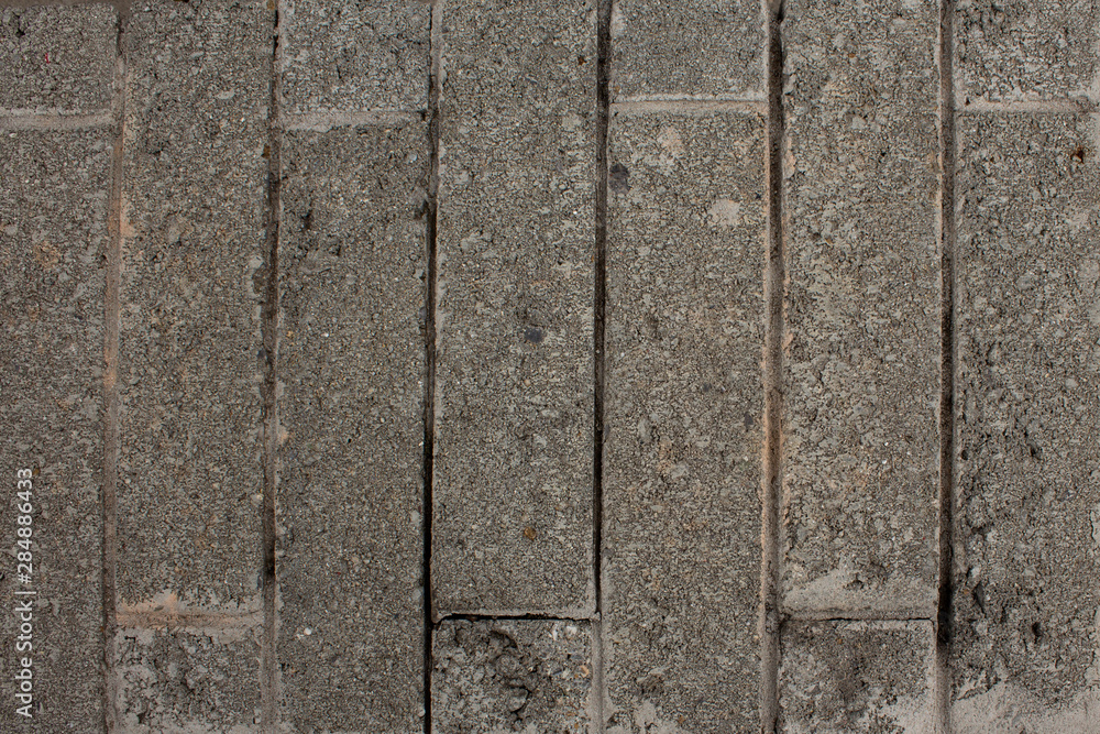 Grey wall tiles vertical texture.