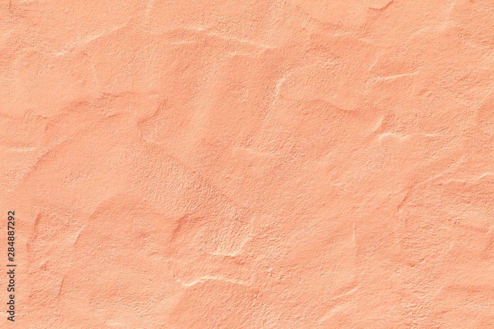 orange plaster wall in rough structure