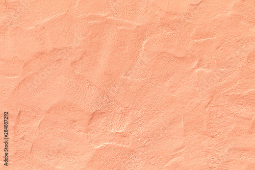 orange plaster wall in rough structure