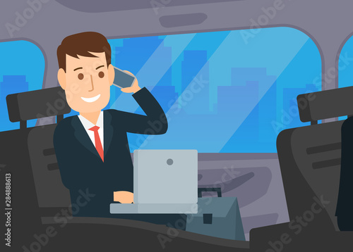 businessman working with laptop and calling on smartphone sitting in car 