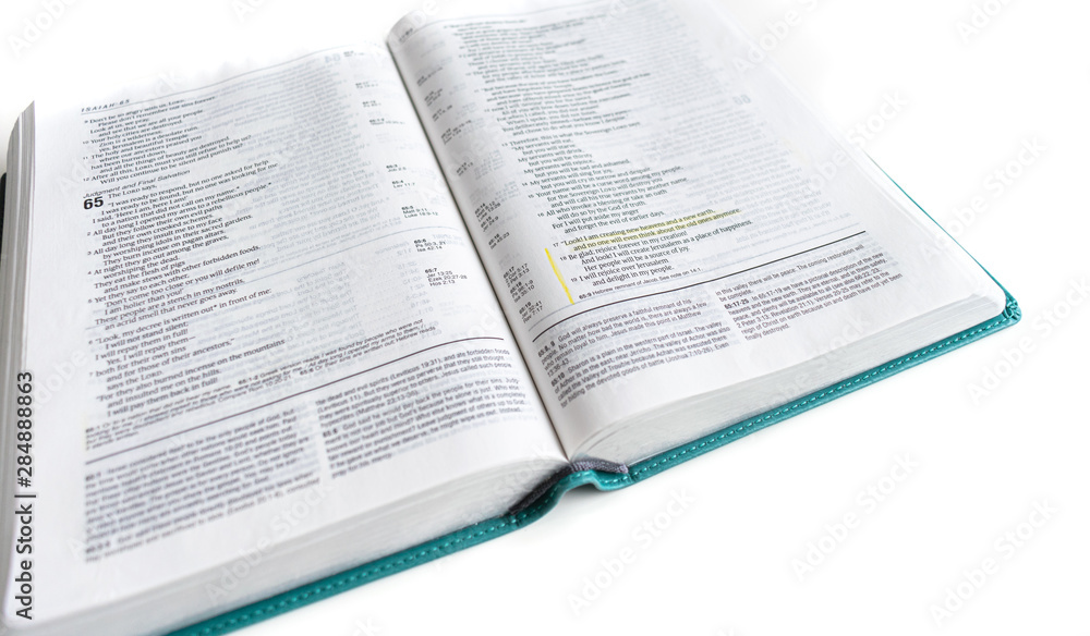 Open Bible isolated on white background. Space for text. - Baselland, Switzerland 19.08.2019 Open Bible isolated on white background. Space for text. - Baselland, Switzerland 19.08.2019
