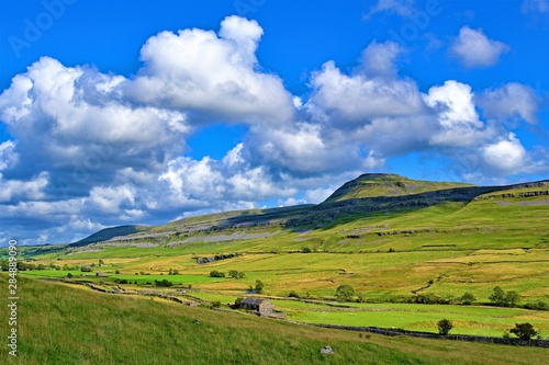 Ingleborough is the final challenge of the famous three peaks.  This view of it is taken within Ingleton. © Peter