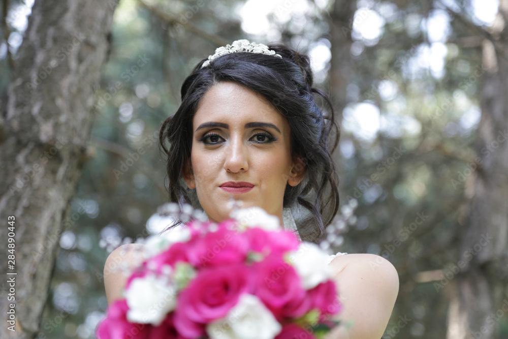 bride holding a purple and white wedding bouquet of flowers. Bride with wedding bouquet bride holding a purple and white wedding bouquet of flowers. Bride with wedding bouquet