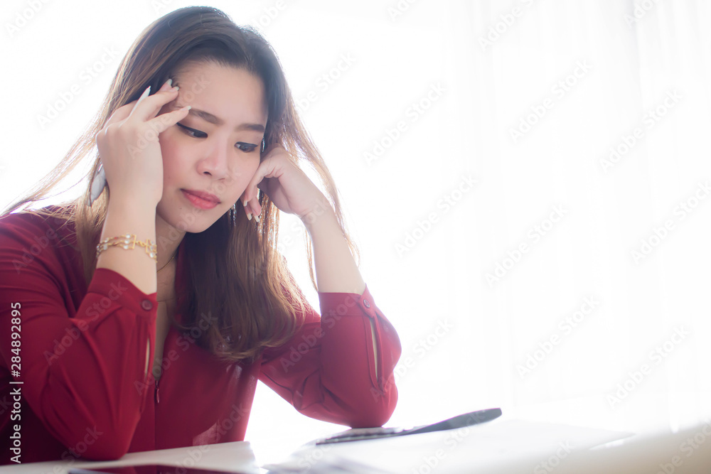 An asian woman is getting stress on her job An asian woman is getting stress on her job