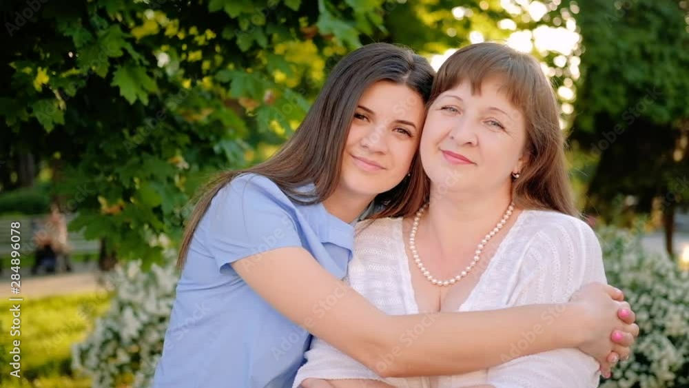 Casual family leisure. Bonding support attention. Happy mother daughter embracing. Casual family leisure. Bonding support attention. Happy mother daughter embracing.