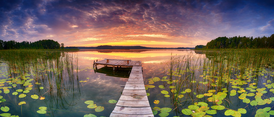 Beautiful summer sunrise over lake - Panorama
