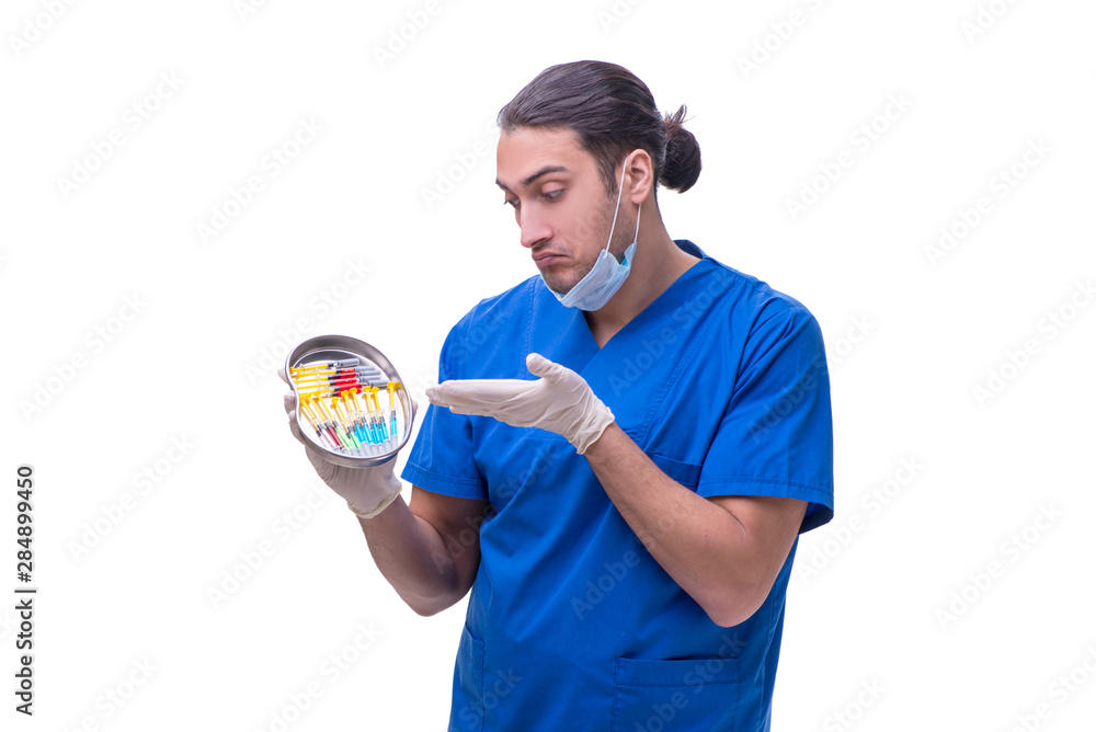 Young handsome doctor with syringe isolated on white Young handsome doctor with syringe isolated on white