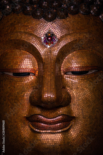 Golden Buddha image face style , hilight and shadow of buddha golden face