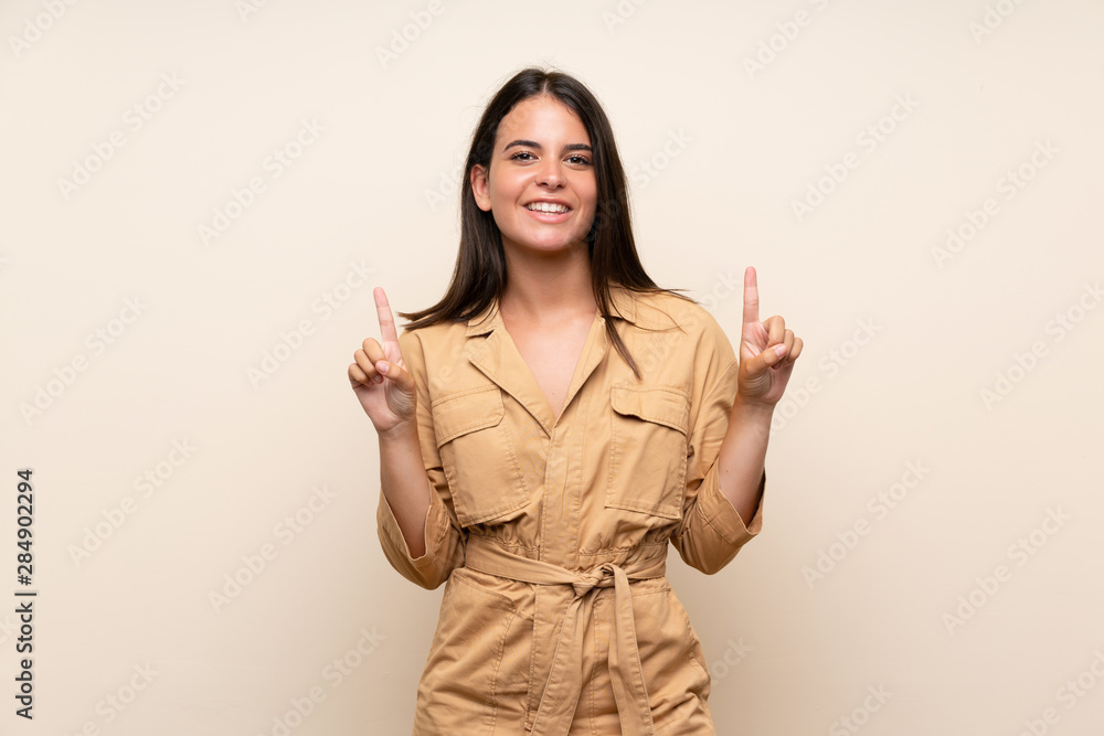Young girl over isolated background pointing up a great idea Young girl over isolated background pointing up a great idea