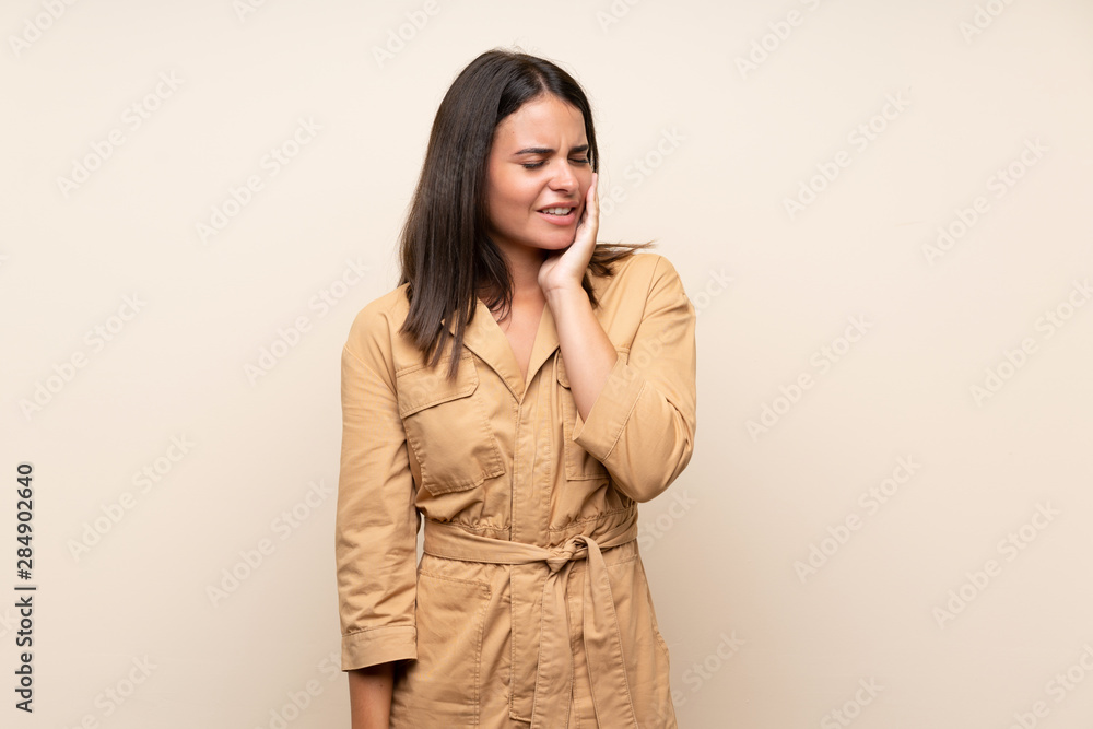 Young girl over isolated background with toothache Young girl over isolated background with toothache