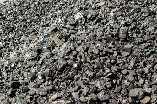 Pile of natural black hard coal for texture background. Grade anthracite coals often referred to as stone coal and black diamond coal. photo