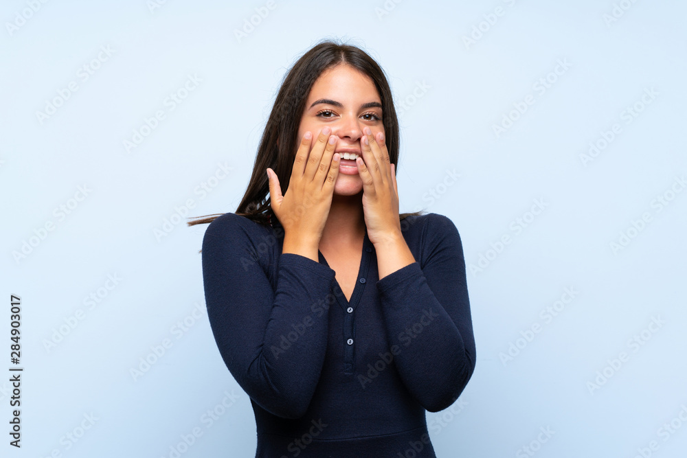 Young girl over isolated blue background with surprise facial expression Young girl over isolated blue background with surprise facial expression