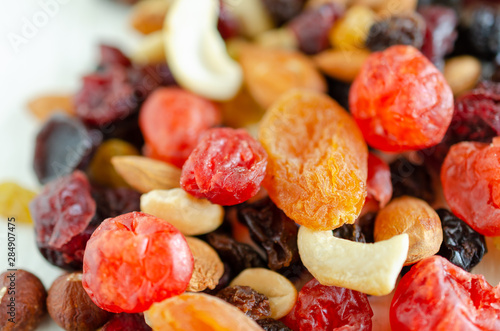 Mix of dried fruits and nuts close up background