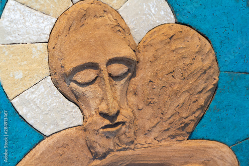 Bratislava, Slovakia. 2018/5/22. A relief sculpture of Jesus Christ embracing a person. Made out of modelling clay by Lubo Michalko. Displayed in the Quo Vadis Catholic House.