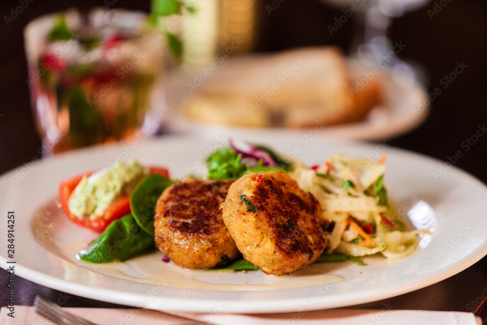 Crab cake appetizer on a white plate. Crab cake appetizer on a white plate.