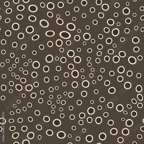Brown circles inscribed in each other. Randomly scattered dots seamless pattern. Perfect design for wrapping paper, fashionable fabric, wallpaper.