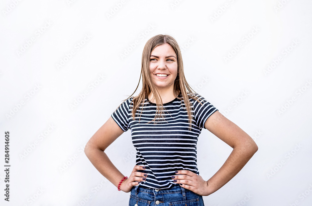 Beautiful smiling caucasian woman with clean skin, natural make-up in casual clothes on grey background Beautiful smiling caucasian woman with clean skin, natural make-up in casual clothes on grey background