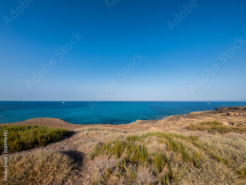 View of the beautiful San Lorenzo rock beach  in the southern Sicily  Italy. The shot is taken during a sunny summer day