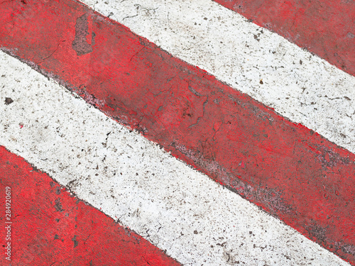 red and white stripes on asphalt road