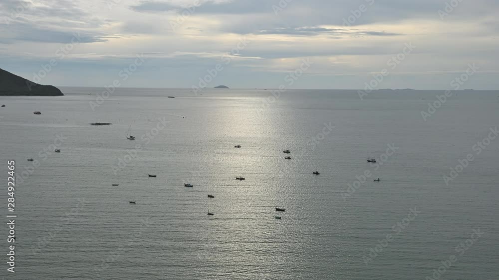 Day to night time lapse wide angle view of fishing boats over the ocean, see sunset with moving cloud. Day to night time lapse wide angle view of fishing boats over the ocean, see sunset with moving cloud.