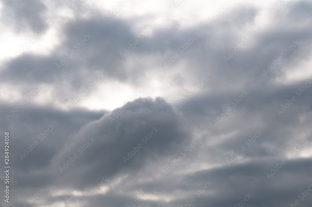 Fototapeta premium gloomy clouds with a gleam of the sun