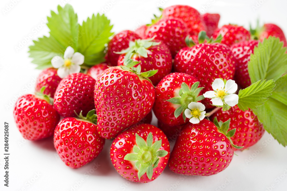 Fresh ripe strawberries offered as closeup on white background with copy space – isolated Fresh ripe strawberries offered as closeup on white background with copy space – isolated