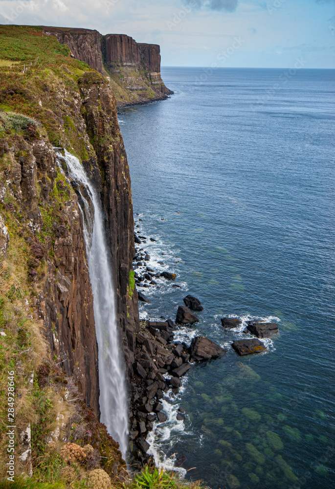 The famous Kilt rock with the Mealt falls at the Isle of Skye in the Highlands of Scotland