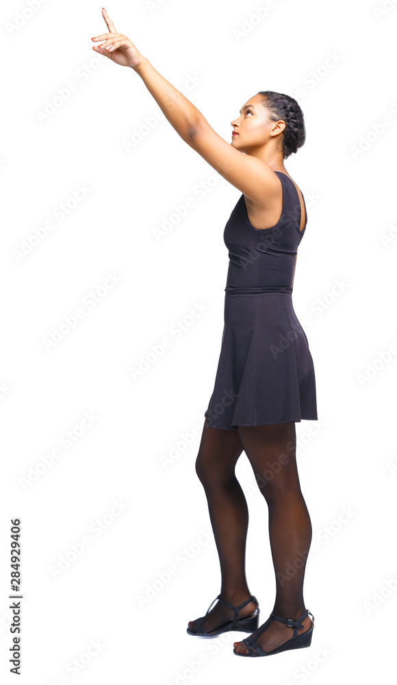 Back view of walking young black girl. Back view of walking young black girl.