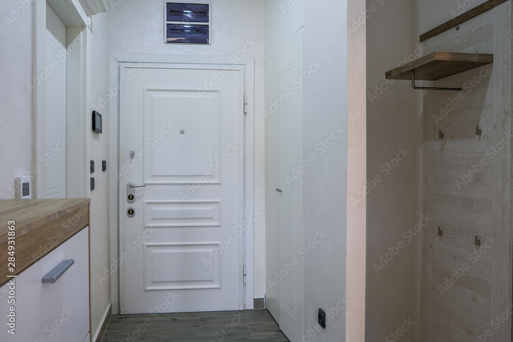 Photograph of a hallway in an apartment building Photograph of a hallway in an apartment building