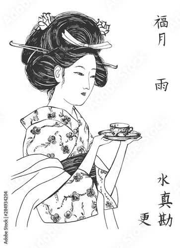 Japanese geisha in kimono with teacup