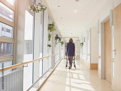 Senior woman with walking frame in nursing home photo