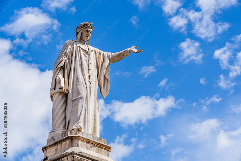 Monument to Dante Alighieri a 19th-century statue of the poet Dante sculpted by Tito Angelini located in Plazza Dante Naples, Italy
