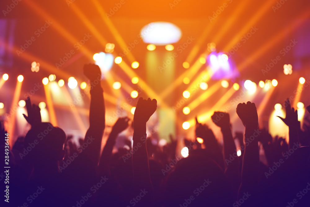 silhouettes of , Fun concert party rock disco light background. silhouettes of , Fun concert party rock disco light background.