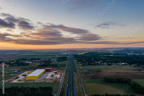 Aerial drone photography of the city suburbs, highway around the main city. 