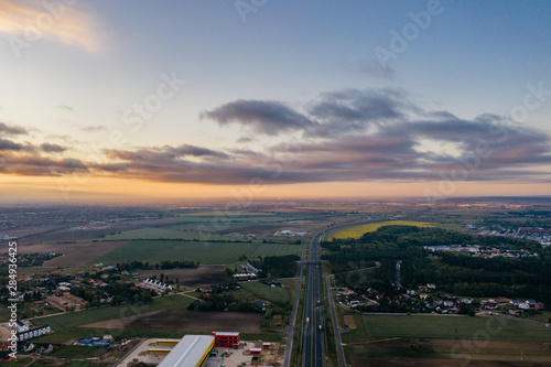 Aerial drone photography of the city suburbs, highway around the main city. 