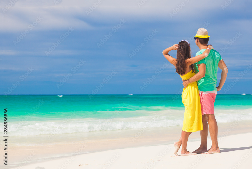 Beach couple walking on romantic travel honeymoon vacation summer holidays romance. Young happy lovers, Cayo LArgo, Cuba