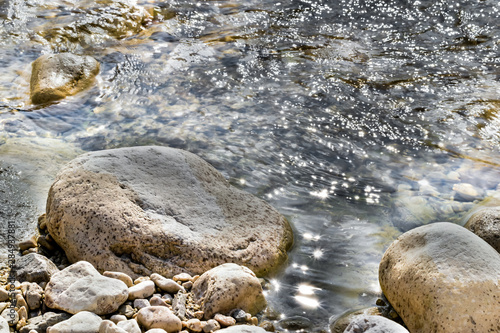 glittering water of the riverbank on a sunny summer day,hdr image photo