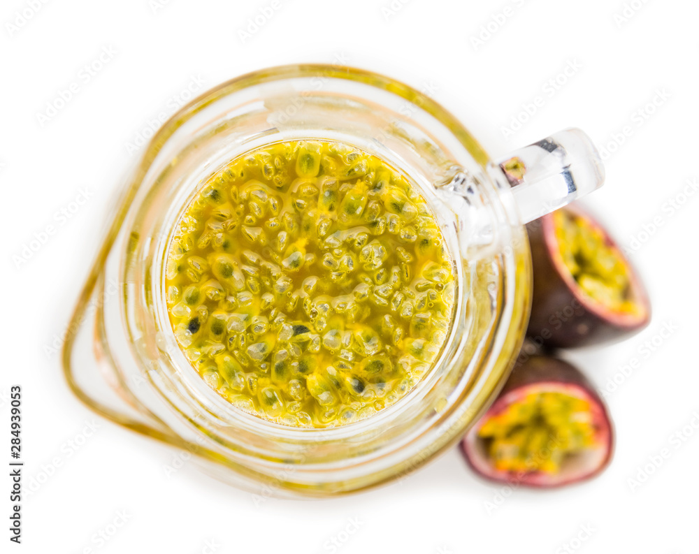 Maracuja Juice as detailed close-up shot isolated on white background (selective focus). Maracuja Juice as detailed close-up shot isolated on white background (selective focus).