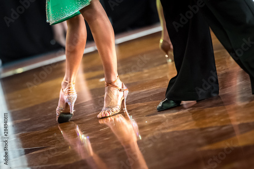 Legs of young dancers on the dance floor