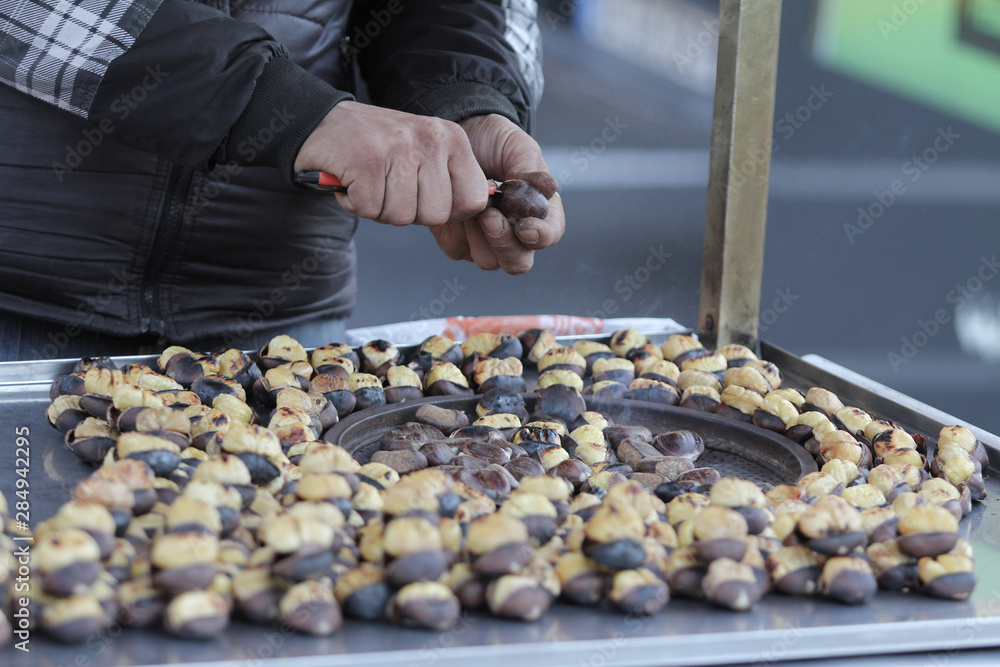  sellers selling chestnuts on the street