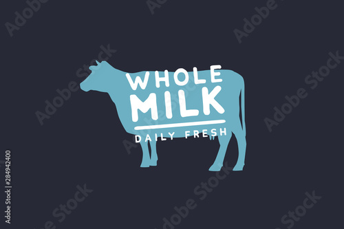 Logo template with a blue cow silhouette and whole milk inscription. Emblem for dairy stores, markets, packaging and advertising. Vector illustration on dark background.