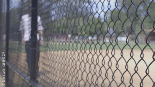 Man walking through baseball field