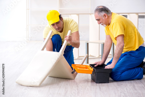 Two contractors carpenters working indoors © Elnur