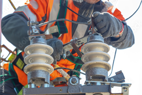 Working electrician works with electrical equipment