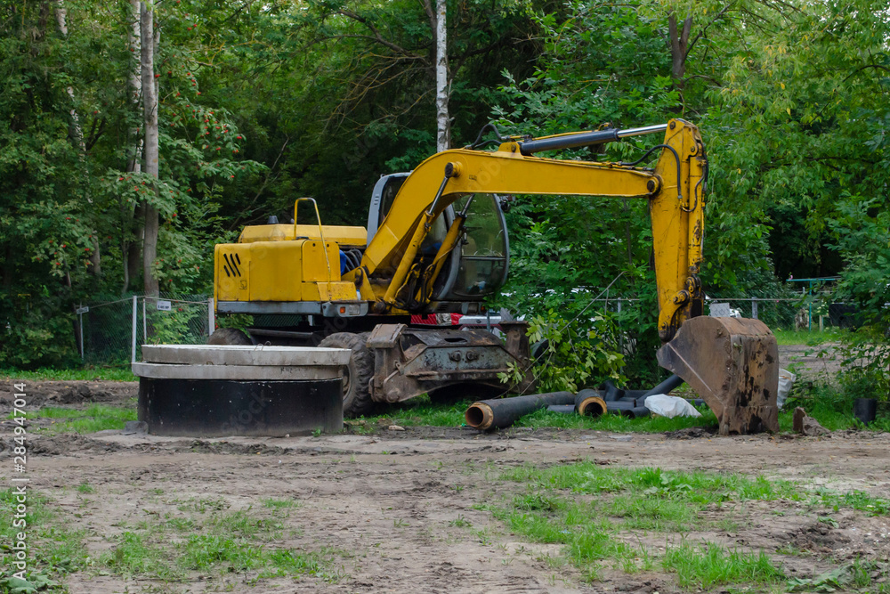 yellow Excavator machine standing with the pile yellow Excavator machine standing with the pile