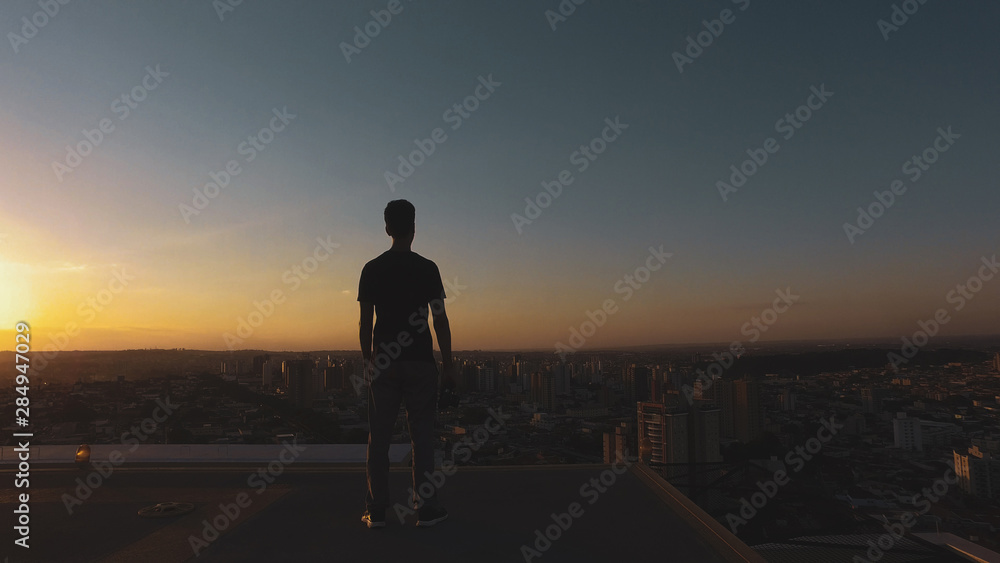 Man photographer silhouette at sunset