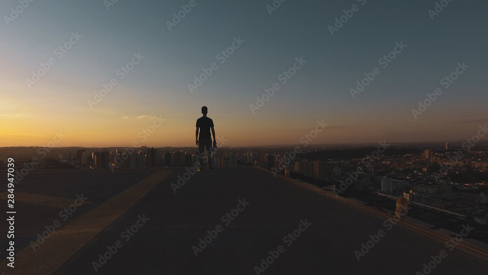 Man photographer silhouette at sunset Man photographer silhouette at sunset