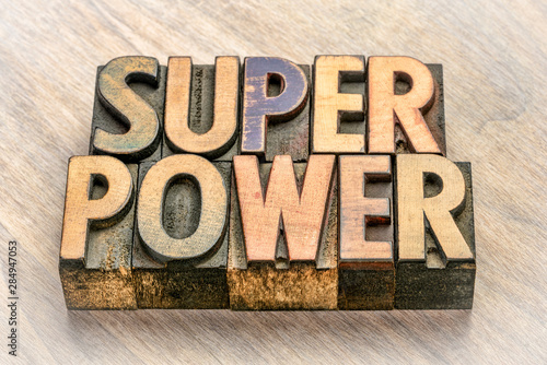 superpower word abstract in wood type photo