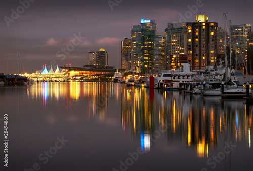 Coal Harbour Twilight Lights. The Vancouver skyline reflects in Coal Harbour at night. British Columbia  Canada.